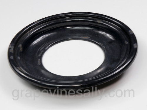 PLEASE READ FULL DESCRIPTION
This is a well used black porcelain enameled drip tray. There are a few small chips and normal sculling. Please do not expect a pristine drip tray. The metal integrity is excellent - this is a solid drip tray. If you are missing your drip tray/s or it is badly dented chipped or stained - these may be an affordable replacement. We have a limited supply of these drip trays.

MEASUREMENTS: Top Outer Most Edge Diameter 8-3/4"   /    Top Side Grate Rest Ledge Diameter 7-3/4" 