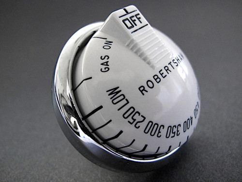 Original Re-conditioned Vintage Robertshaw Original Oven Gas Control Knob with Spring and Chrome Bezel Ring. There are no cracks or stains - this knob has been re-lettered. Includes the knob, chrome bezel ring, and spring. Works with the original vintage Robertshaw Model BJ thermostats.

PLEASE NOTICE: The rear of bezel ring 'sleeve' varies in depth on some stove models as does the rear knob stem length. This knob stem is 1-1/2". Please compare with the knob and bezel you are currently using - give us a call if you have any questions. 

All of our new chromed parts are 'Triple Plated' (copper, nickel, chrome).