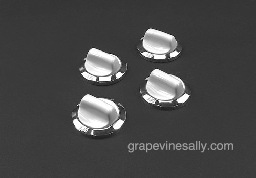 Set of 4 Original Western Holly Stove Burner Control Knobs with Chrome Bezel Ring.

We have re-conditioned these knobs. There are no cracks, chips or stains - the rear "D" is in excellent condition. These work well on most vintage stoves that use a flush mount knob and the standard rear "D".

If you need one or two more singles, they are available in the store.

Color: White

Fits the standard rear "D" valve stem - Diameter of rear bezel: 2.0"