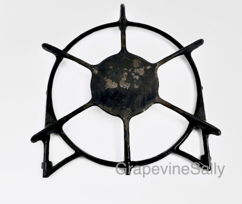 SAVE OODLES!
PLEASE READ FULL DESCRIPTION. This is a VERY WELL used original vintage O'Keefe & Merritt gas stove burner grate. The simmer plate has several chips in the porcelain enamel.This is the thinner cast style with 3 short pegs on the underside. Often found on the later 50's early 60's OK&M stoves including the built-in counter top drop-in OM stoves from the early 60's.

Our used grates & burners all have various degrees of wear and have been well used. No grates will be cracked. We give our used grates and used burners a light cleaning, (we won't sell greasy parts) however you may want to give them a bit more TLC. 

MEASUREMENTS: Outer Ring Width 8-3/8"  -  vertical measurement, to top of center spoke 9-3/4"