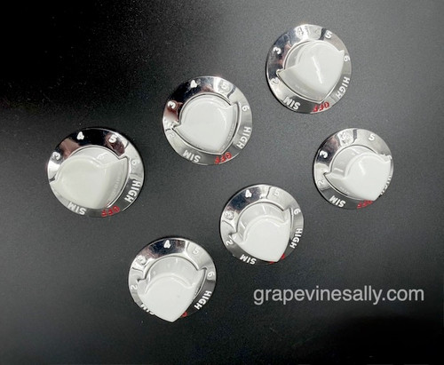 Vintage Electric Stove Set of 6 Burner Burner Control Knob Dials. These dials are in excellent condition. We have reconditioned the set. There are no chips, cracks or stains. This is a gorgeous set. Please view all photographs prior to making your purchase.

Each original vintage knob is reconditioned and thoroughly inspected for quality - 

MEASUREMENTS: Diameter of chrome bezel: 1-5/8"
