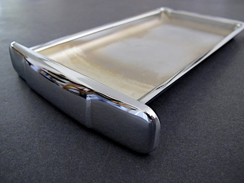 NEW CHROME Center Griddle Grease Drip Tray. This is the thin indented pull style. Fits the vintage 1940's-1950's Wedgewood Gas Stoves. The metal integrity is excellent.
MEASUREMENTS (does not incl. the handle pull): 8-3/4" x 4-7/8"