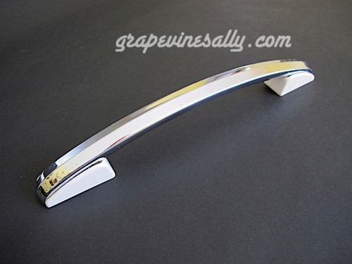 Original 1940-1950's Vintage Classic Wedgewood Stove Oven Door Handle. Fits the vintage 40's - 50's Wedgewood Gas Stoves. There are no cracks, chips or stains on the bakelite end trim. 
 
PLEASE NOTE, the chrome portion yet still quite shiny, does have some light pitting / 'flea-bites'. This is not a perfectly pristine handle, it is a completely solid and functional handle. Please view all photos to be certain you are OK with all details. Handle has been thoroughly cleaned and ready to install.
 
MEASUREMENTS: Overall Length 12.0"  /  Mounting Holes 10.0" (on center)