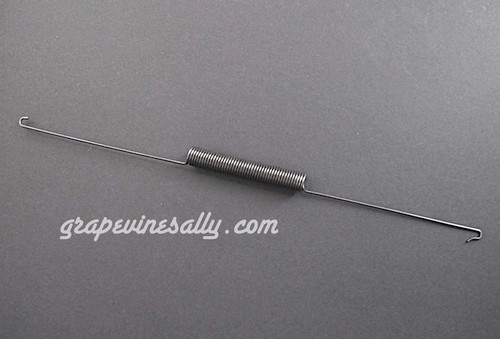 Vintage O'Keefe & Merritt Gas Stove USED BROILER DOOR SPRING - Good used condition. Good tension. 
MEASUREMENTS: Overall Length 14.25"  /  Coil 3.25"  /  Lead (ea. end) In 5.50"