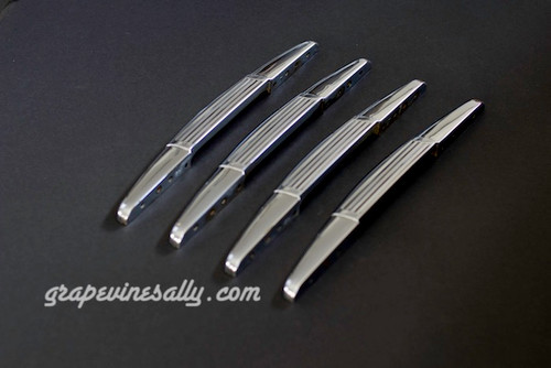 Set of 4 Original 1940-1950's Vintage Classic Wedgewood Stove Chrome Ribbed Style Oven Door Handles. Although the chrome is used, these handles are as close to new chrome as on can get in a used set of handles. These are very nice bright and shiny handles. Fits the vintage 40's - 50's Wedgewood gas stoves. 
 
MEASUREMENTS: Overall Length 14.0"  /  Mounting Holes 10.0" (on center)