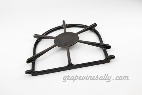 Original Vintage Wedgewood Stove Used Porcelain Enameled Stove Top Burner Grate. This is a very solid used grate. This is the style with the smaller simmer plate. The porcelain enamel shows normal wear. There will be normal 'scuff' from pots and pans. However, these used grates do not have any chipped porcelain enamel. Our used grates all have various degrees of normal wear/scuff. Please view all photos.
Regarding Cleaning:

We clean the heavy grease (if any), but you still may want to give it a more thorough cleaning. (Super-Clean in the purple container on Amazon works great.)
MEASUREMENTS: 7-1/2" side to side of horseshoe ring