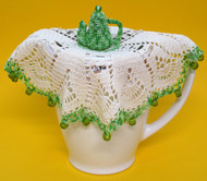 Jug cover with teapot centre shown on jug