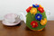 CMPATC090 Love Those Daisies Tea Cosy (4 Cup) decorated with brightly coloured daisies constructed on a daisy wheel