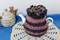 CMPATC093  Crocheted teacosy for 4 cup pot featuring bands of contasting broomstick crochet.