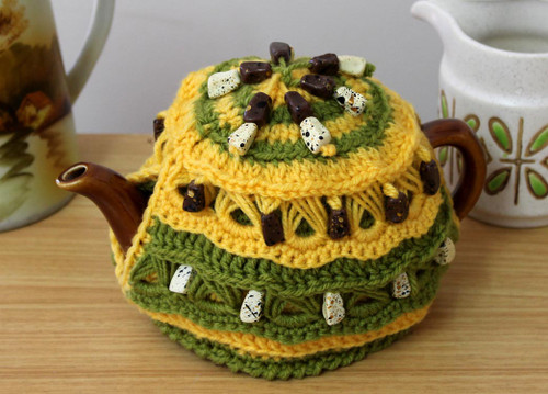CMPATC094 Crocheted 2 cup tea pot cosy featuring bands of beaded broomstick crochet.