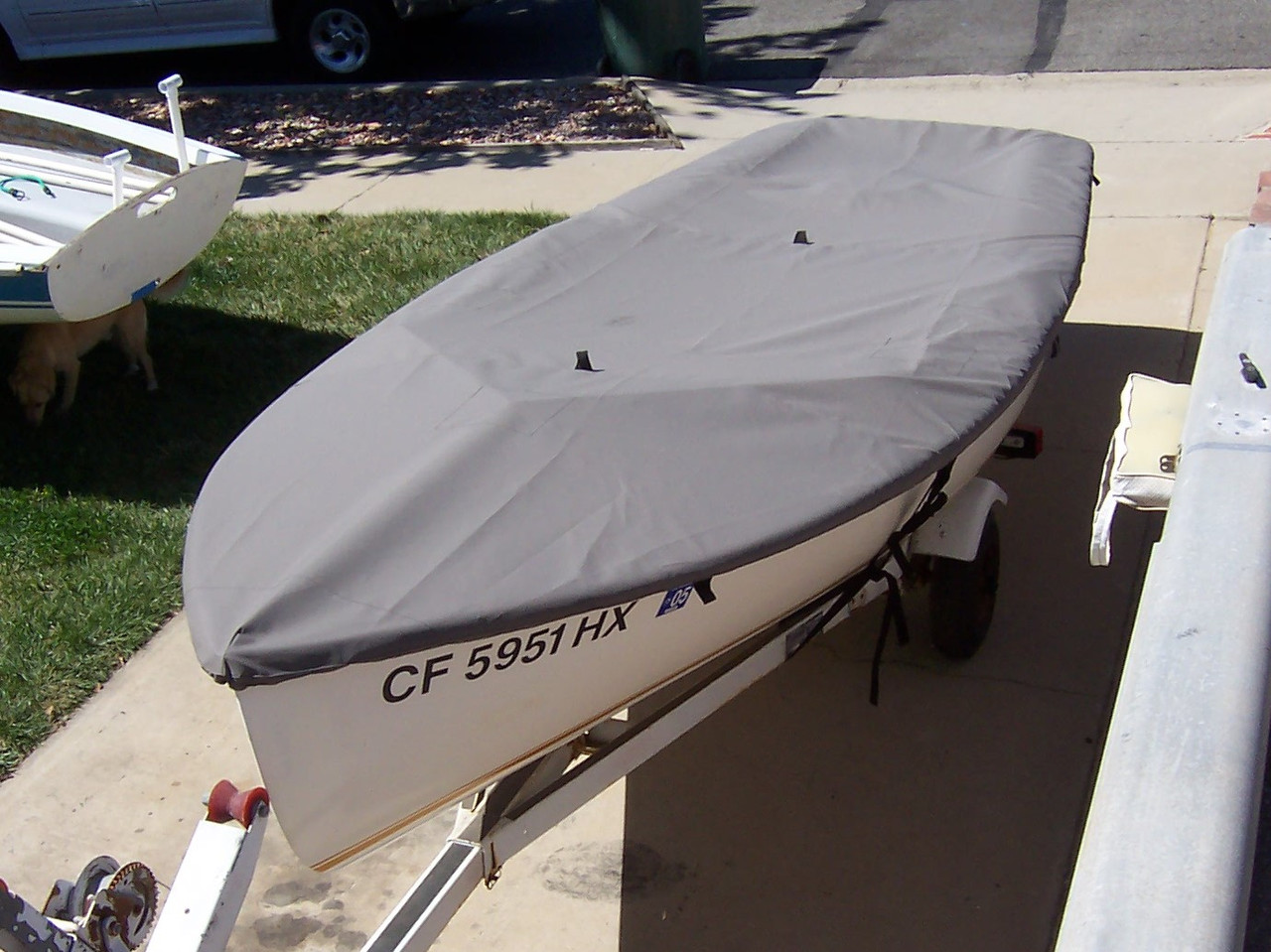 Vagabond 14 Sailboat Top Deck Cover made in America by skilled artisans at SLO Sail and Canvas. Cover shown in Polyester Charcoal Gray. Available in 3 fabrics and many color choices.
