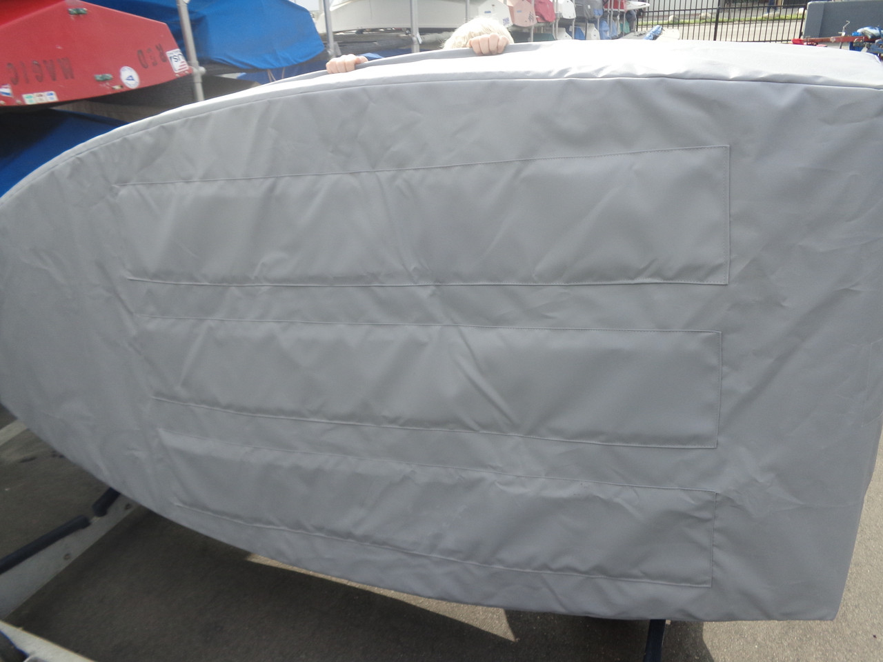 Opti Sailboat Padded Hull Cover made in America by skilled artisans at SLO Sail and Canvas. Features (three) 1/4" urethane closed cell foam pads on the bottom of the cover. 
