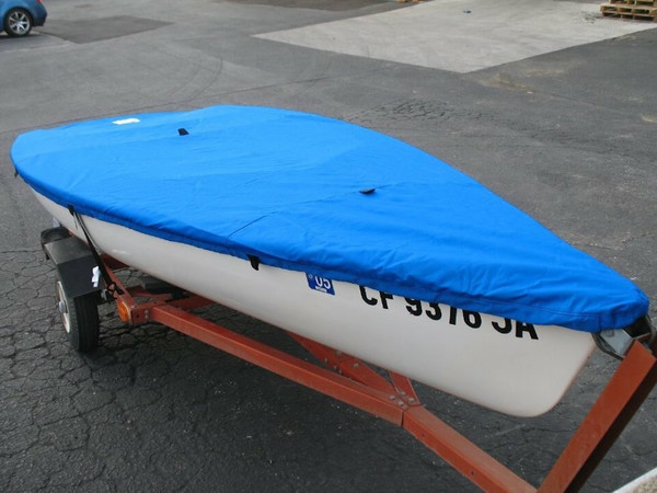 Sailboat Top Deck Cover to fit a Hobie® One 12 by LO Sail and Canvas. Reinforcements positioned over blocks and cleats prevent chafing. Webbing loops are sewn around the perimeter of our top covers allowing your cover to be tied to your boat. 
