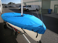 Apollo 16 Mast Up Flat Mooring Cover by SLO Sail and Canvas. Shown in Sunbrella Pacific Blue fabric type. Optional Upgrade: Straps with plastic Fastex buckles shown. 