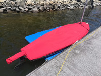 Dolphin Sr. Sailboat Mast Up Flat Cover made in America by skilled artisans at SLO Sail and Canvas. Cover shown in Sunbrella Jockey Red. Available in 3 fabrics and many color choices.

