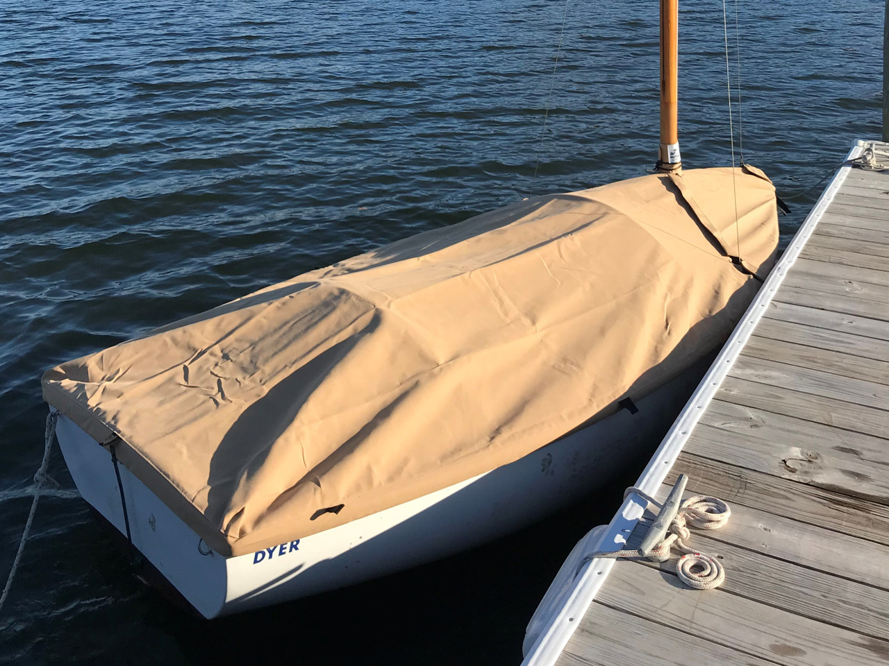 Keep your Dyer Dink dinghy free of leaves and dirt with a Mast Up Flat Cover by SLO Sail and Canvas.