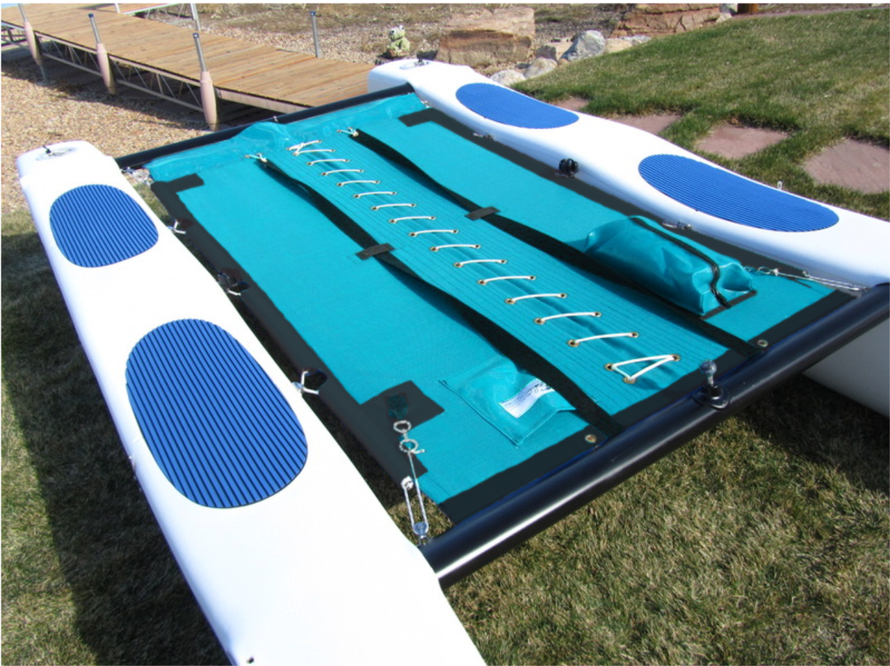 Trampoline with Centerlace to fit a Hobie® Wave Classic catamaran made in America by skilled artisans at SLO Sail and Canvas. Shown in Textilene 90 Lake Blue. Optional Zipper Pocket shown in photo.