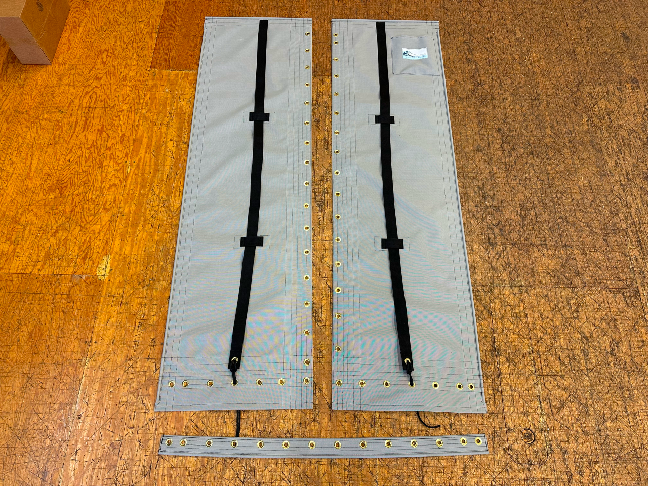3pc Trampoline to fit a Hobie Wave Club catamaran made in America by skilled artisans at SLO Sail and Canvas. Hand pounded #4 brass spur grommets. Adjustable hiking straps made of 2” Polypropylene webbing. 12” X 12” halyard pocket, included. 