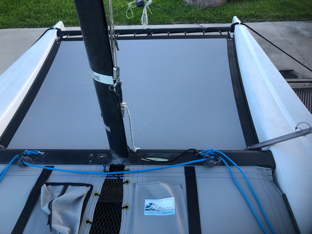 Forward Bias Cut Textilene 90 Mesh Trampoline to fit a Hobie® Getaway catamaran shown in Dusk Grey. 