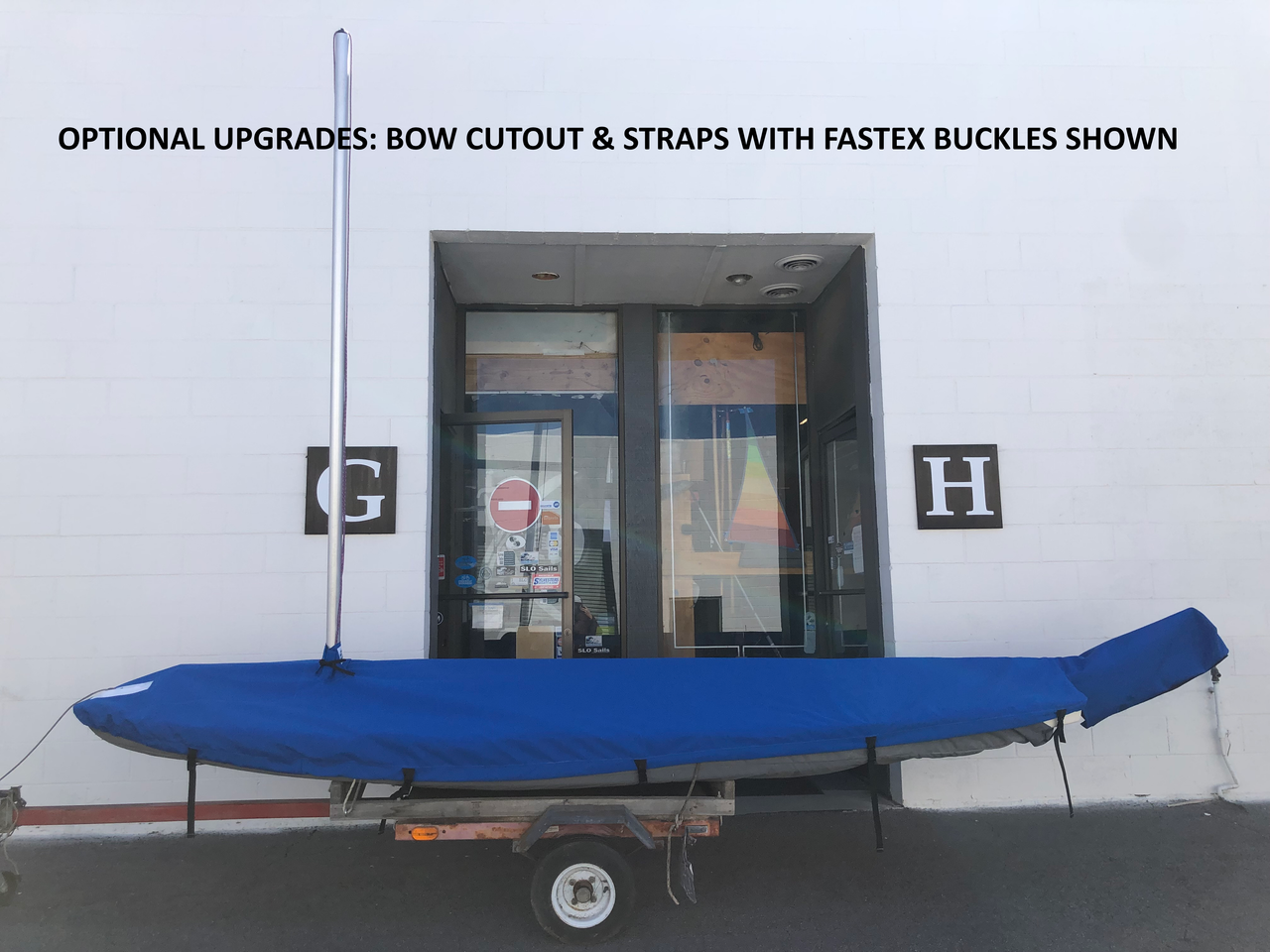 Sunfish Mast Up Flat + Rudder Cover Cover by SLO Sail and Canvas shown in Sunbrella Pacific Blue with optional upgrades: Bow Cutout & Straps with Fastex Buckles. 