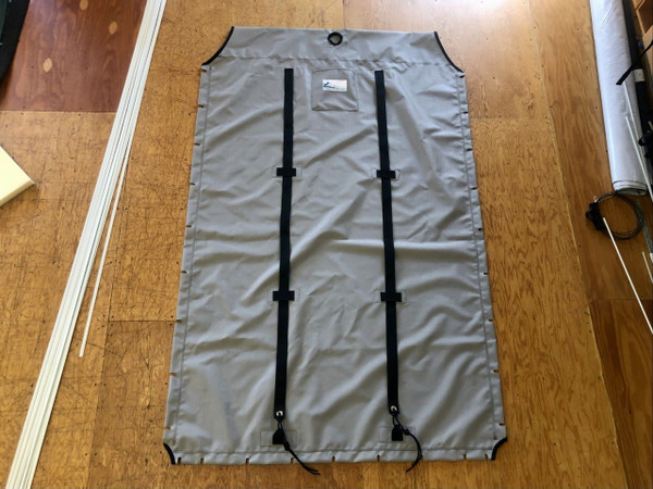 Trampoline for an Escape Playcat Catamaran. Made in America by SLO Sail and Canvas. Made with premium Textilene 90 mesh. Available in Dusk Grey (shown) or Lake Blue.  Adjustable hiking straps made of 2” polypropylene webbing. 12” X 12” Halyard pocket, included. 