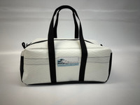 Our Sailcloth and Trampoline Mesh Duffel Bag is the perfect choice for a weekend away - on or off the water. These bags are made from one of Dimension-Polyant’s laminate fabrics with double sided taffeta and catamaran trampoline mesh. This sail cloth gives the bag a pleasing white sail look, and a crisp shape. The 8oz Polypropylene basket weave black trampoline mesh allows for drainage and the airing out of wet sailing gear. The medium bag is 10” tall, 11.5” wide, and 26” long. The duffel bag has one big compartment with two strong webbing handles and a double zipper pull closure.

