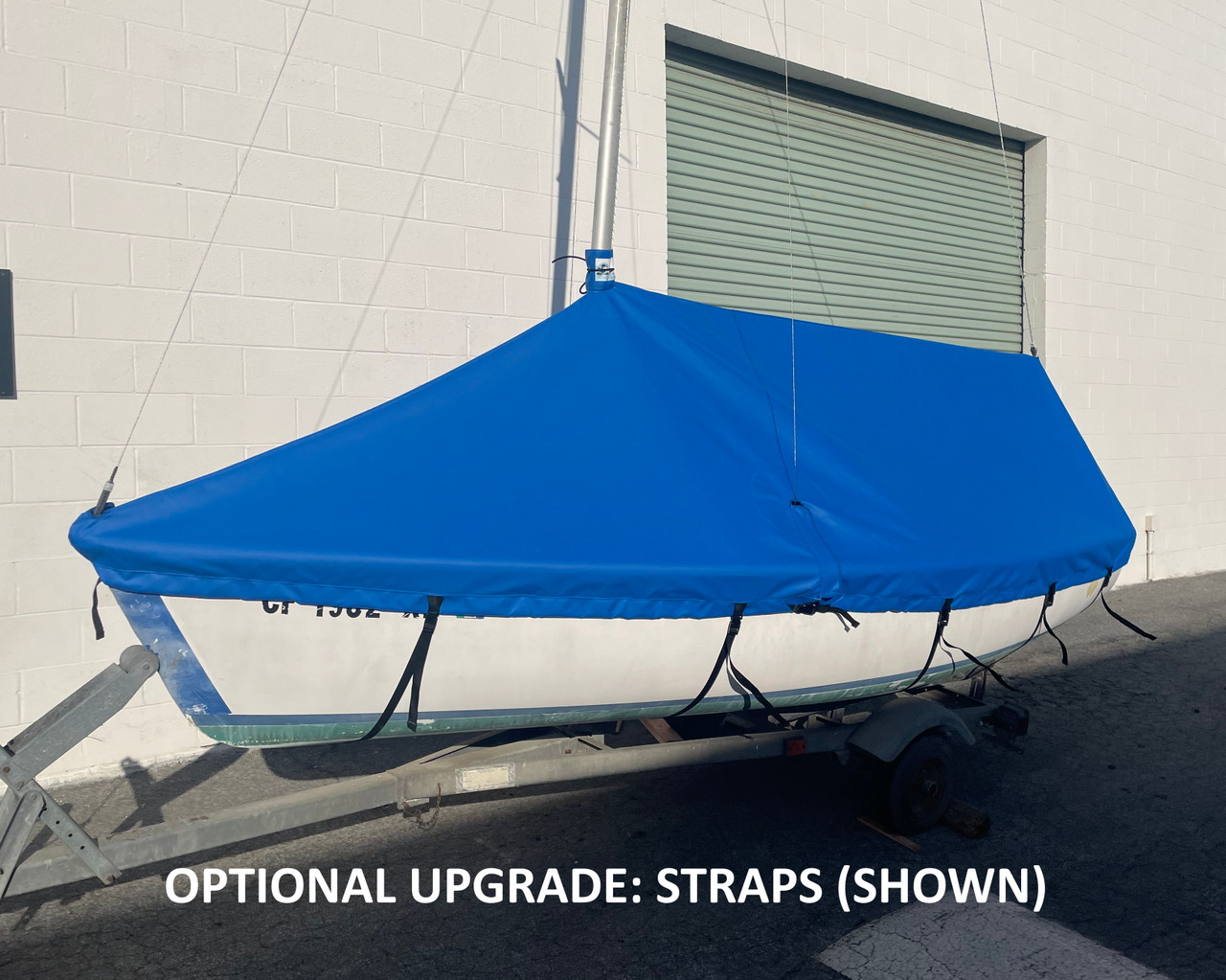 Capri 14.2 by Catalina Mast Up Tented Mooring Cover by SLO Sail and Canvas. Shown in Top Gun Carribean Blue, with optional "straps with fastex buckles." Our mast up tented covers feature forestay, shrouds, topping lift, and mast cutouts. A durable #10 zipper and plastic zipper car (with UV protective flap) will withstand the elements for years and years. Sturdy shock cord is sewn into the perimeter of the cover to secure the cover to your boat. 