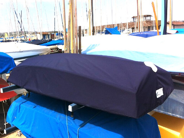 Naples Sabot Sailboat Hull Cover made in America by skilled artisans at SLO Sail and Canvas. 1/4" shockcord is built into cover to secure your cover tightly around the boat's rubrail. All of our covers are patterned from the actual boats they are designed to fit. This make for a better, higher quality product.
