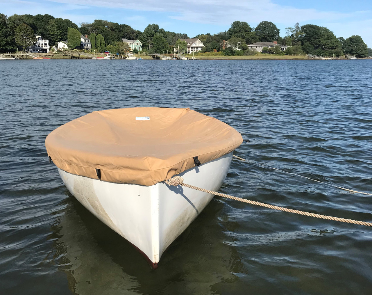 The Top Deck Boat Cover from SLO Sail and Canvas is custom tailored to perfectly fit your Dyer Dink 10 sailboat. 