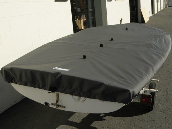 420 Sailboat Top Cover made in America by skilled artisans at SLO Sail and Canvas. Web Loops allow you to “tent” your cover up to prevent pooling of water. 1/4" shockcord is built into cover to secure your cover tightly around the boat's rubrail. 
