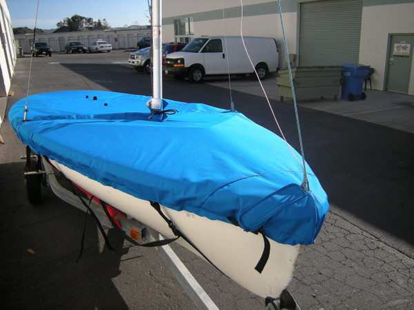 Vanguard 420 Sailboat Mast Up Flat Mooring Cover made in America by skilled artisans at SLO Sail and Canvas. 1/4" shockcord is built into cover to secure your cover tightly around the boat's rubrail. Web Loops allow you to “tent” your cover up to prevent pooling of water. 

