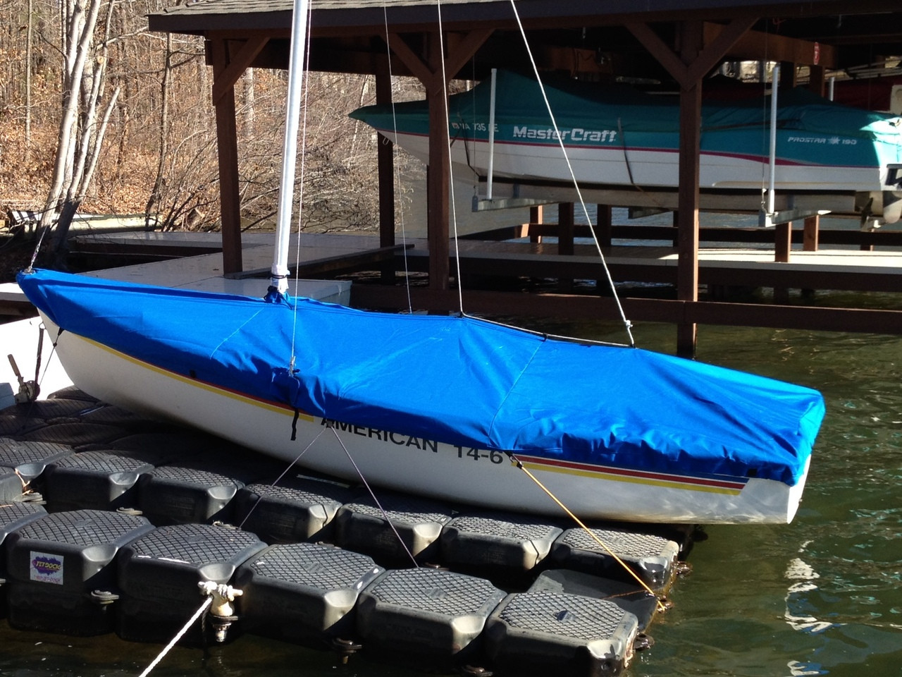 American 14.6 Mast Up Flat Cover by SLO Sail and Canvas. Shown in Sunbrella Pacific Blue. 