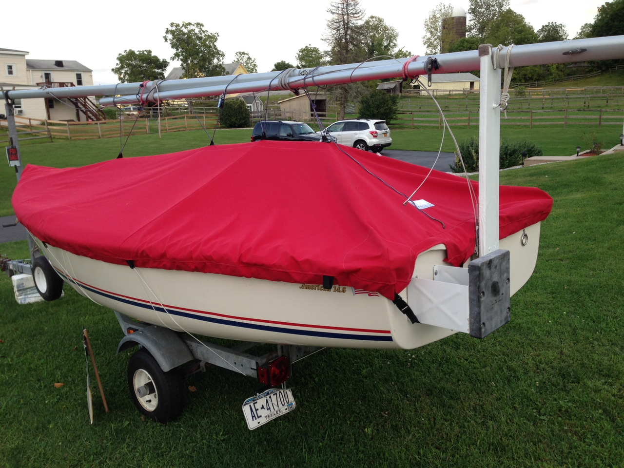 American 14.6 Top Deck Cover by SLO Sail and Canvas. Shown in Sunbrella Jockey Red. 