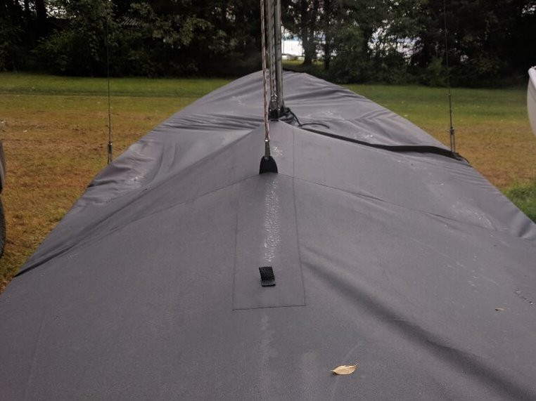 Widgeon Sailboat Top Cover by SLO Sail and Canvas. 1/4" shockcord is built into cover to secure your cover tightly around the boat's rubrail. Web Loops allow you to “tent” your cover up to prevent pooling of water. 
