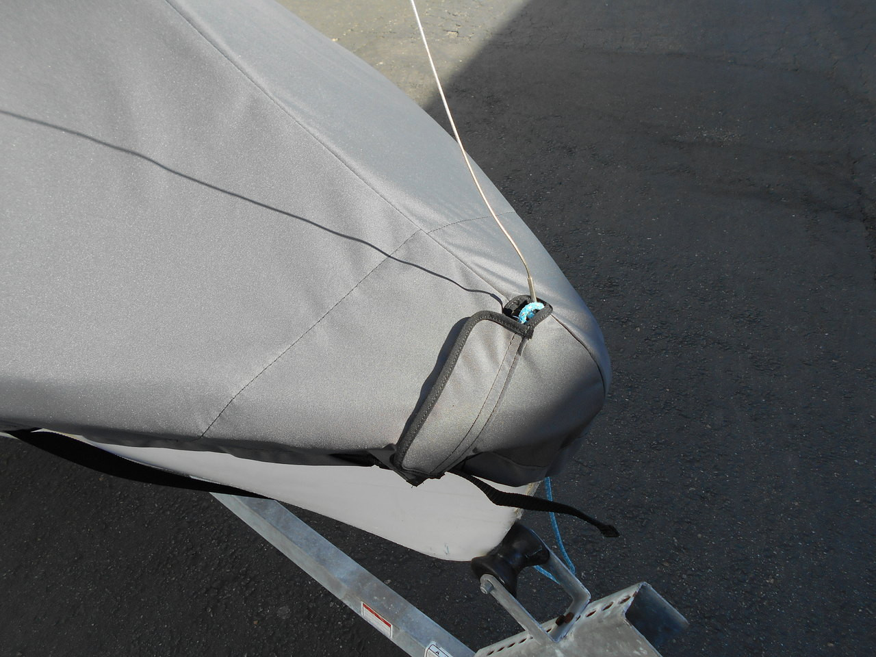 420 sailboat Mast Up Peaked Cover by SLO Sail and Canvas. A mast collar and perfectly placed shroud cutouts fit tightly around your boat’s rigging. 
