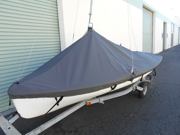 420 sailboat Mast Up Peaked Cover made in America by skilled artisans at SLO Sail and Canvas. 1/4" shockcord is built into cover to secure your cover tightly around the boat's rubrail. Web Loops allow you to “tent” your cover up to prevent pooling of water. 

