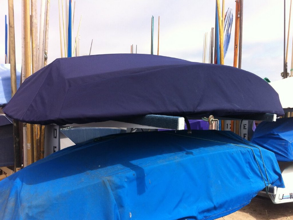 Sabot Sailboat Hull Cover by SLO Sail and Canvas shown in Sunbrella Captain Navy. Available in 4 fabrics and many color choices.
