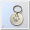 A single dog paw print on a stainless steel keychain