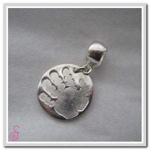 A Sterling Silver circular handprint charm with optional Pandora-type attachment