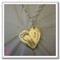 A single Sterling Silver heart-shaped footprint necklace