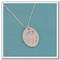 A single Sterling Silver oval-shaped footprint necklace