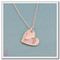 A single Sterling Silver heart-shaped footprint necklace