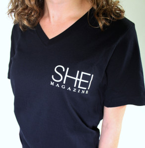 100% cotton, black, v-neck, ladies t-shirt with small SHEI logo on upper right. Available in sizes S, M, and L