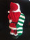 RED VELVET SANTA WITH LONG GREEN AND WHITE STOCKING