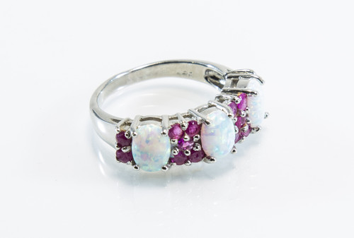 Lab-Created Opals Patterned With Natural Rubies. 