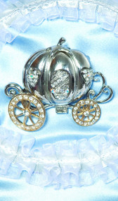 Pumpkin carriage brooch with rhinestones. Pumpkin is silver, the wheels are gold.