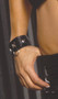Leather wrist cuffs with square nail heads, heart nail heads and o ring. Adjustable snap closure.