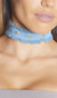 Wide denim choker with frayed edges and gold grommet detail and adjustable lobster clasp closure.