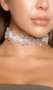 Rhinestone flower bloom choker with adjustable lobster clasp closure. Measures about 1-1/8" tall.