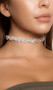 Rhinestone bubble choker with adjustable lobster clasp closure. Measures about 1/2" tall.